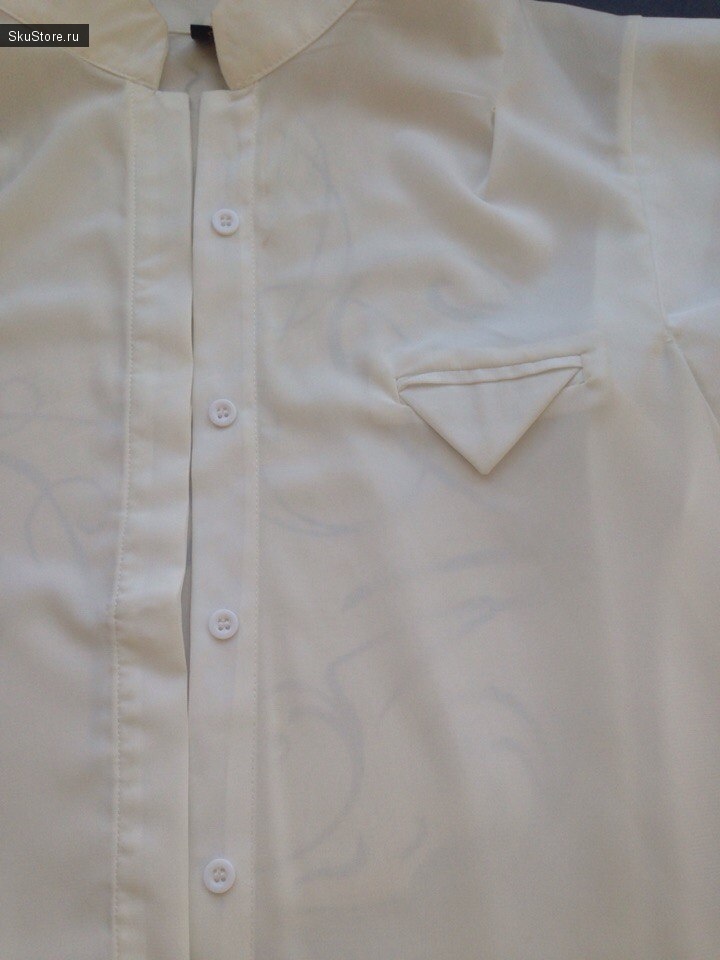 Белая блузка - фото крупным планом